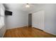 This bedroom has hardwood floors, a ceiling fan and a closet at 2223 Jay Se Ln, Smyrna, GA 30080