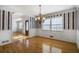 Dining room with hardwood floors, wainscoting, and a view to the front door at 2223 Jay Se Ln, Smyrna, GA 30080