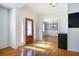 Bright foyer with hardwood floors, and decorative glass front door at 2223 Jay Se Ln, Smyrna, GA 30080