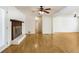 Hardwood floors and a fireplace with a brick base in the living room at 2223 Jay Se Ln, Smyrna, GA 30080