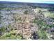 Beautiful aerial view of home nestled among natural surroundings, featuring mature trees and green pastures at 302 Vinson Mountain Loop, Rockmart, GA 30153