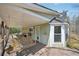 Covered back porch featuring a porch swing and view of the expansive yard at 302 Vinson Mountain Loop, Rockmart, GA 30153