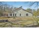 View of the house with a back porch and expansive backyard, offering privacy at 302 Vinson Mountain Loop, Rockmart, GA 30153