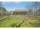 Expansive backyard featuring a covered porch and fencing at 302 Vinson Mountain Loop, Rockmart, GA 30153