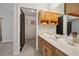 Bathroom vanity with wooden cabinets and access to a closet at 302 Vinson Mountain Loop, Rockmart, GA 30153