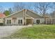 Charming home with a stone facade, well-maintained lawn, and inviting front entrance at 302 Vinson Mountain Loop, Rockmart, GA 30153