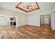 Spacious living room featuring a decorative ceiling, fireplace, and wood-look flooring at 302 Vinson Mountain Loop, Rockmart, GA 30153