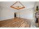Spacious living room featuring a decorative ceiling, fireplace, and wood-look flooring at 302 Vinson Mountain Loop, Rockmart, GA 30153
