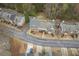 Overhead view of townhouses with manicured lawns and tree-lined streets in a residential neighborhood at 5980 Eagle Tiff Ln, Sugar Hill, GA 30518