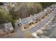 Overhead view of a row of townhouses featuring gray roofs and well-maintained landscaping at 5980 Eagle Tiff Ln, Sugar Hill, GA 30518