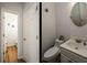 Half bathroom with tile floors and a modern vanity with sink at 5980 Eagle Tiff Ln, Sugar Hill, GA 30518