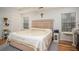 Bedroom features natural light, a ceiling fan and classic decor at 5980 Eagle Tiff Ln, Sugar Hill, GA 30518