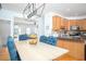 Eat-in kitchen with stainless steel appliances and custom wood cabinetry at 5980 Eagle Tiff Ln, Sugar Hill, GA 30518