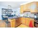 Modern kitchen with stainless steel appliances, granite countertop and island at 5980 Eagle Tiff Ln, Sugar Hill, GA 30518