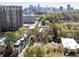 Stunning aerial view of cityscape, green trees, and property, boasting a prime urban location at 1821 Huntington Hills Nw Ln, Atlanta, GA 30309