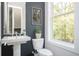 Stylish powder room featuring pedestal sink and designer accents at 1821 Huntington Hills Nw Ln, Atlanta, GA 30309