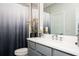 Cozy bathroom featuring gray cabinets, white countertop and a decorative shower curtain for a relaxing atmosphere at 1821 Huntington Hills Nw Ln, Atlanta, GA 30309