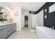 Stylish bathroom with double vanity, frameless glass shower, and soaking tub for a spa-like experience at 1821 Huntington Hills Nw Ln, Atlanta, GA 30309