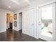 Bright hallway with hardwood floors, white doors, and access to a private outdoor space for relaxation at 1821 Huntington Hills Nw Ln, Atlanta, GA 30309