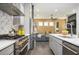 Open concept kitchen flowing into the living area, featuring stainless steel appliances and modern finishes at 1821 Huntington Hills Nw Ln, Atlanta, GA 30309