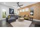 Beautiful living room with designer wallpaper, modern furnishings, and plenty of natural light at 1821 Huntington Hills Nw Ln, Atlanta, GA 30309