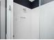 Modern shower with white subway tile, glass door, and convenient built-in niche for toiletries at 1821 Huntington Hills Nw Ln, Atlanta, GA 30309