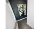 Staircase with decorative artwork and wood floors at 1821 Huntington Hills Nw Ln, Atlanta, GA 30309