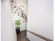 Bright stairwell features a modern art installation and a lush green potted plant at 1821 Huntington Hills Nw Ln, Atlanta, GA 30309