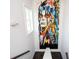 Unique artwork and a window accent the stairwell, creating a distinctive, bright space at 1821 Huntington Hills Nw Ln, Atlanta, GA 30309