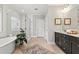 Bathroom featuring a soaking tub, glass shower, and double vanity at 1922 Coal Pl, Atlanta, GA 30318