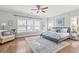 Bedroom with neutral tones, ceiling fan, and large windows at 1922 Coal Pl, Atlanta, GA 30318
