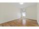 An inviting bedroom featuring beautiful wood floors and a bright window at 1922 Coal Pl, Atlanta, GA 30318