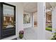 Inviting front porch showcasing a black front door and a glimpse of the outdoor seating area at 1922 Coal Pl, Atlanta, GA 30318