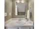 Powder room featuring white vanity, mirror, and textured green walls at 2306 Queen Anne Ct, Atlanta, GA 30350