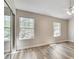 Light-filled bedroom with sliding closet doors and large windows at 2306 Queen Anne Ct, Atlanta, GA 30350