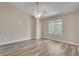 Bright bedroom with large window and ceiling fan at 2306 Queen Anne Ct, Atlanta, GA 30350