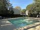 Large community pool with lounge seating, perfect for relaxation and recreation at 2306 Queen Anne Ct, Atlanta, GA 30350
