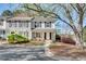 Attractive exterior view of the two-story home with a manicured front yard at 2306 Queen Anne Ct, Atlanta, GA 30350