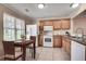 Functional kitchen featuring white appliances, granite countertops, and ample cabinet space at 2306 Queen Anne Ct, Atlanta, GA 30350