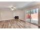 Living room boasts hardwood floors, a fireplace, and sliding glass doors to the exterior at 2306 Queen Anne Ct, Atlanta, GA 30350