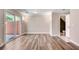Living room boasts hardwood floors, sliding glass doors to the exterior, and a bathroom entrance at 2306 Queen Anne Ct, Atlanta, GA 30350