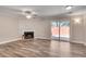Living room boasts hardwood floors, a fireplace, and sliding glass doors to the exterior at 2306 Queen Anne Ct, Atlanta, GA 30350