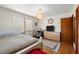 Spacious bedroom with hardwood floors, a cozy rug, and a comfortable desk at 945 Blackwell Rd, Marietta, GA 30066