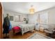 Bright bedroom with hardwood floors, a cozy rug, and natural lighting at 945 Blackwell Rd, Marietta, GA 30066
