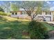 Charming home with red shutters, two-car garage, steps leading to the front door at 945 Blackwell Rd, Marietta, GA 30066