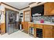 Bright kitchen with stainless steel refrigerator, wine cooler, and wooden cabinets at 945 Blackwell Rd, Marietta, GA 30066