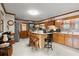 Charming kitchen with wooden cabinetry, central island and stylish backsplash at 945 Blackwell Rd, Marietta, GA 30066