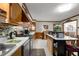 Kitchen featuring stainless steel appliances, wooden cabinetry and breakfast bar at 945 Blackwell Rd, Marietta, GA 30066