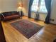 Elegant living room featuring hardwood floors, a classic rug, and cozy furnishings at 945 Blackwell Rd, Marietta, GA 30066
