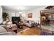 Comfortable living room featuring hardwood floors, area rugs and neutral-toned sofa at 945 Blackwell Rd, Marietta, GA 30066
